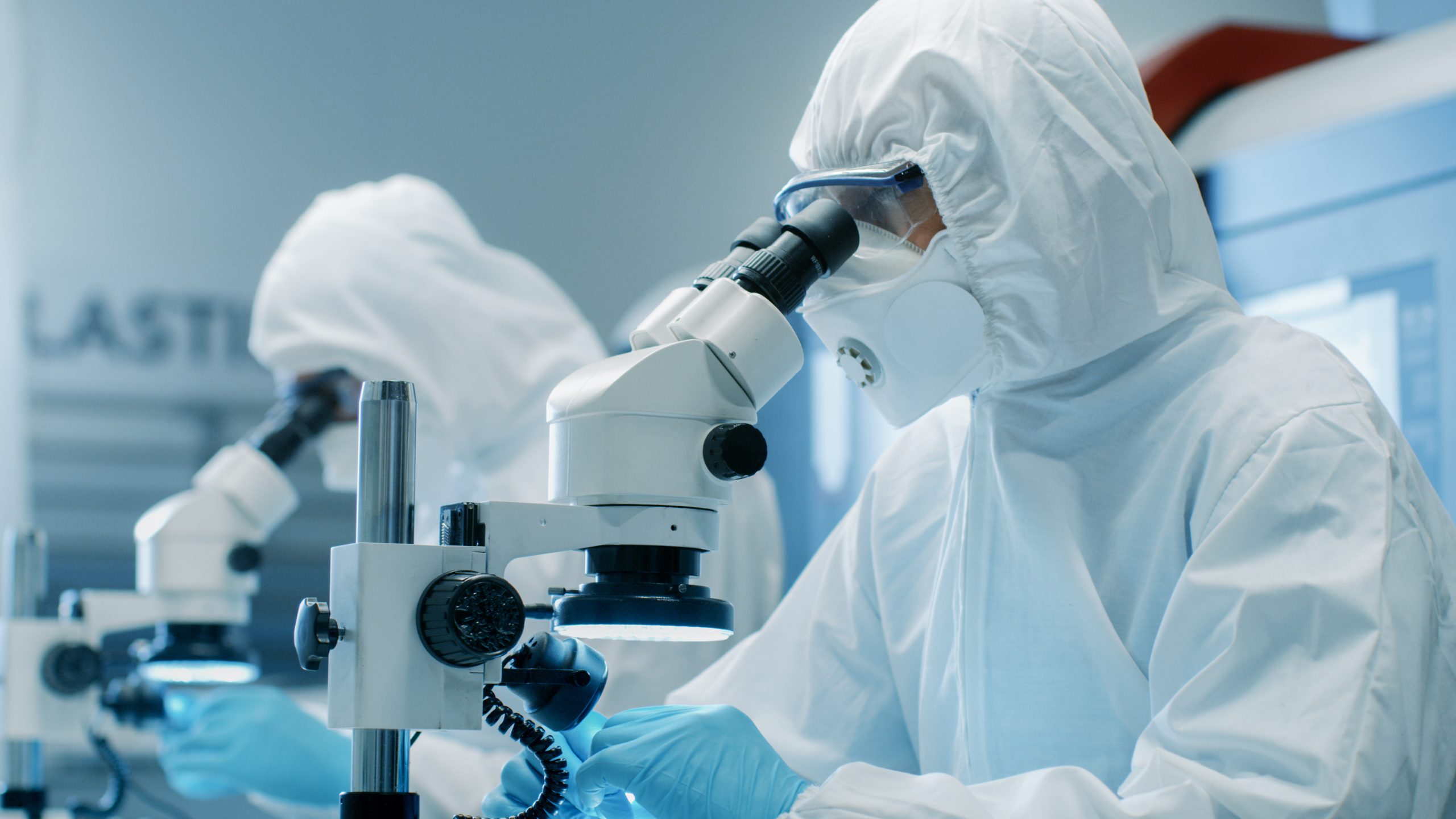 Two Engineers/ Scientists/ Technicians in Sterile Cleanroom Suit